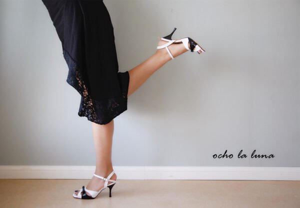 Black and white tango dance shoes with a bow