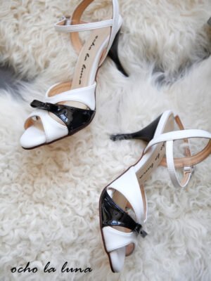 Black and white tango dance shoes with a bow